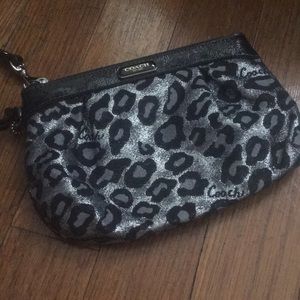Black and silver Coach wristlet